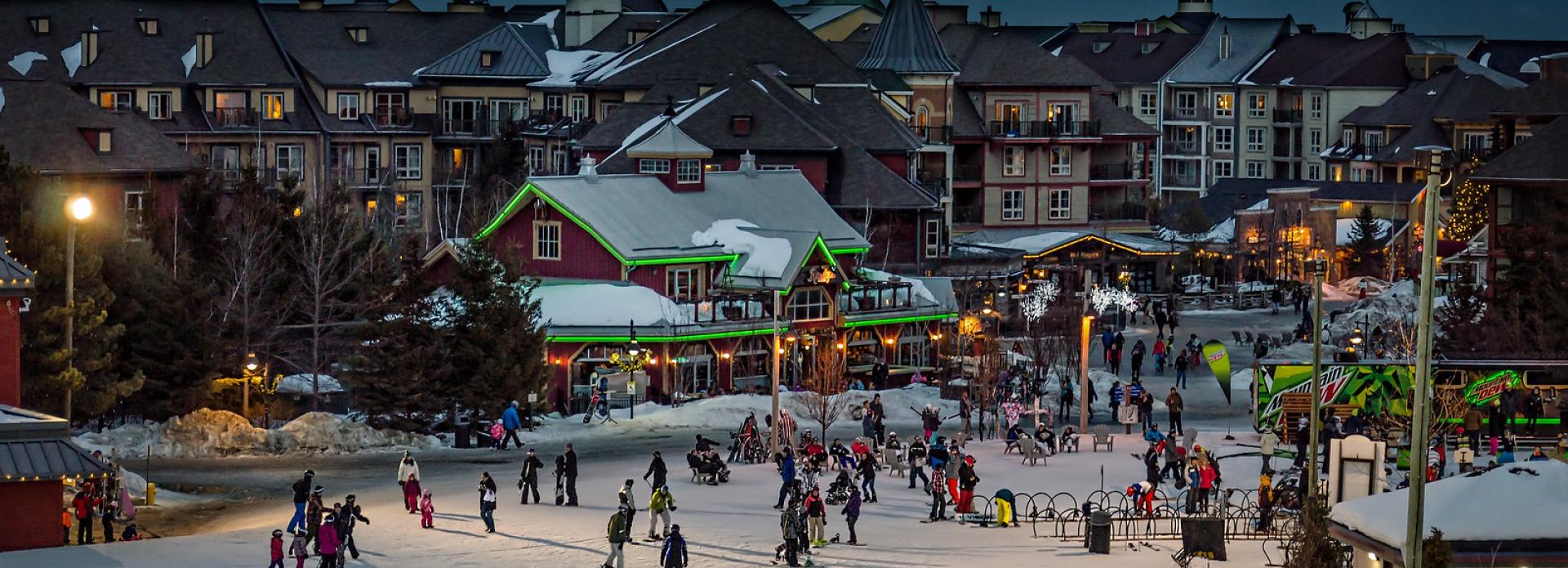 A diverse group of skiers navigates a snowy hill, highlighting the joy of winter sports in a beautiful setting.