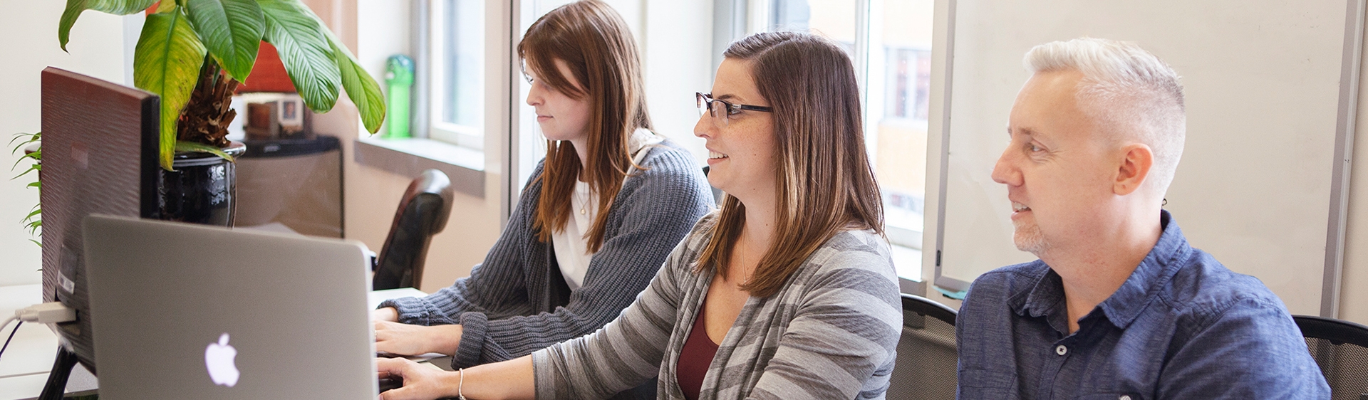 3 people doing user testing in an office