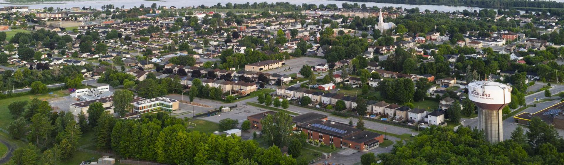 Aerial view of a city with a water tower