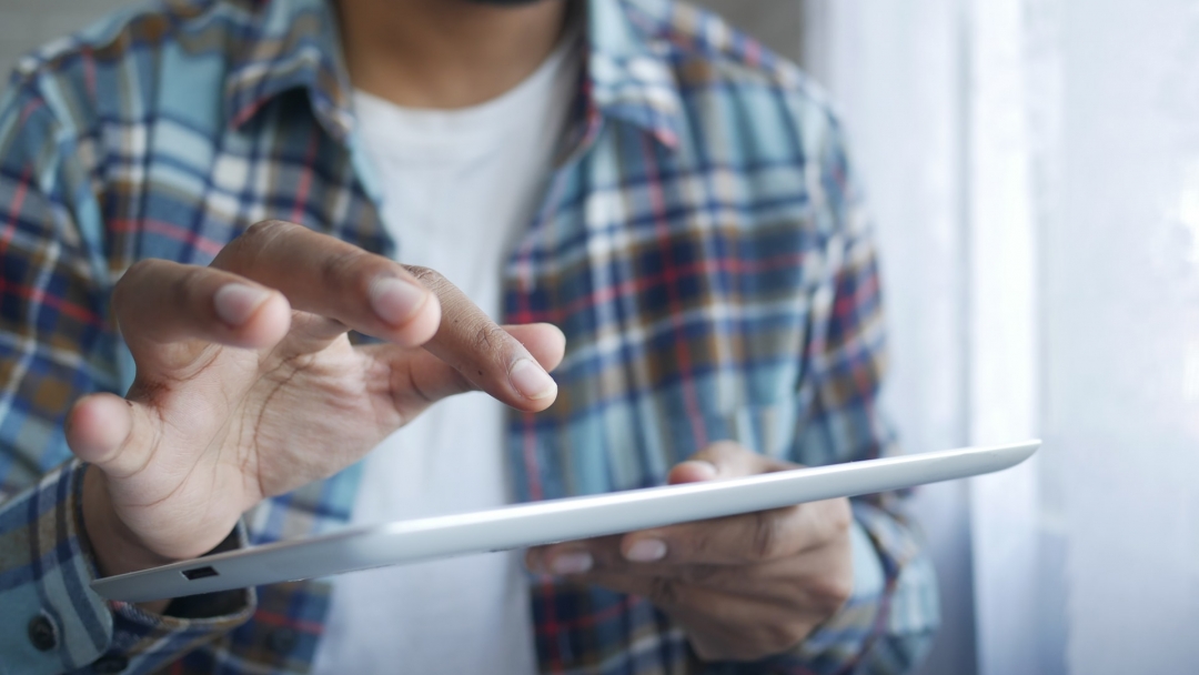 Person using a tablet. 